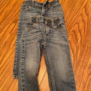 Two pairs Osh Kosh Straight legged jeans.